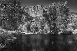 A river view of the towering walls of Yosemite National Park.
